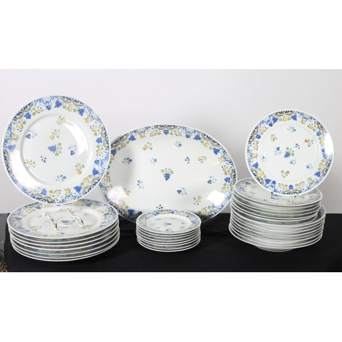 575 - A THIRTY THREE PIECE LIMOGES PART DINNER SERVICE the white ground decorated with fruit comprising ei... 