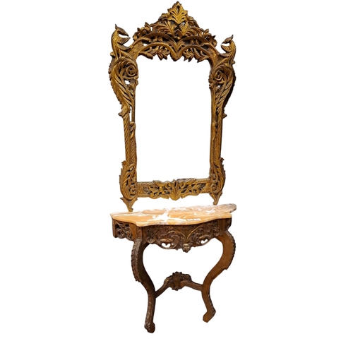 63 - A CONTINENTAL GILT CONSOLE TABLE AND MIRROR the shaped plate within a pierced foliate and C-scroll f... 