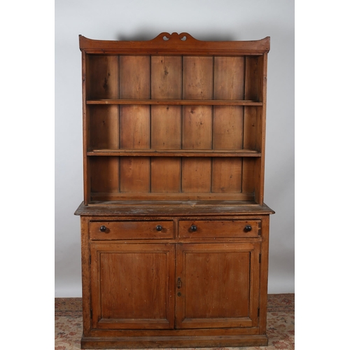 65 - A 19TH CENTURY PITCH PINE OPEN FRONT DRESSER the moulded cornice above three open shelves the base w... 