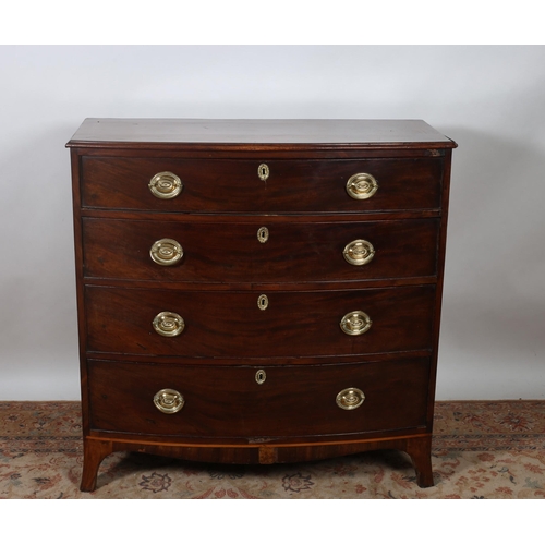 68 - A GEORGIAN MAHOGANY CROSS BANDED CHEST of demi lune outline the shaped top above four long graduated... 