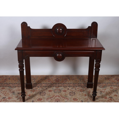 70 - A 19TH CENTURY MAHOGANY SIDE TABLE of rectangular outline the shaped top with moulded back and confo... 