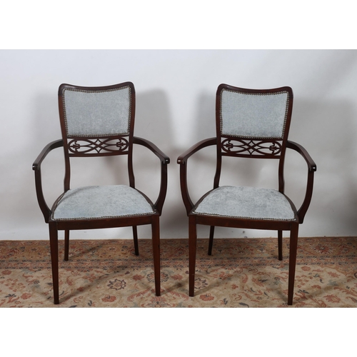 73 - A PAIR OF VINTAGE MAHOGANY AND UPHOLSTERED ARMCHAIRS each with an upholstered back and seat with pie... 