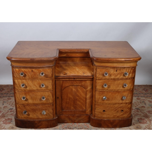 75 - A 19TH CENTURY SATIN BIRCH CHEST of rectangular bowed outline the shaped top above a writing compart... 