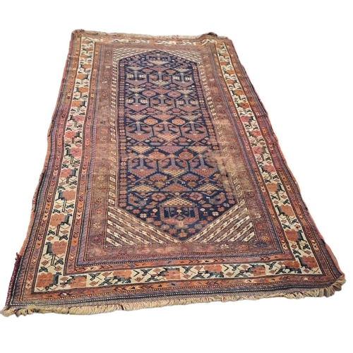 THREE ORIENTAL WOOL RUGS (AF) The light blue ground with central panel