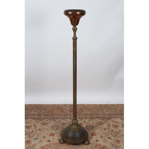 82 - A 19TH CENTURY BRASS AND COPPER JARDINIERE STAND the reeded column with copper bowl raised on a circ... 