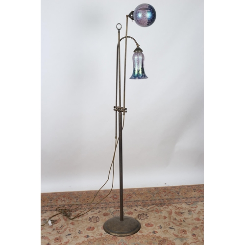 83 - AN ART NOUVEAU DESIGN BRASS TWO BRANCH FLOOR STANDARD LAMP the reeded and tubular columns issuing tw... 