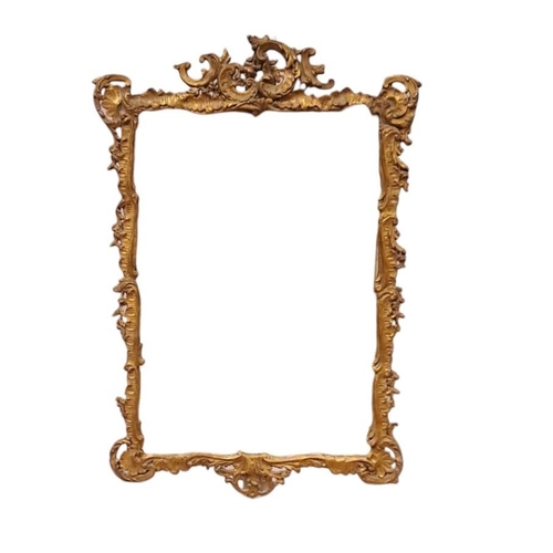 830 - A CONTINENTAL GILT FRAME MIRROR the rectangular plate within a flowerhead and foliate moulded frame ... 