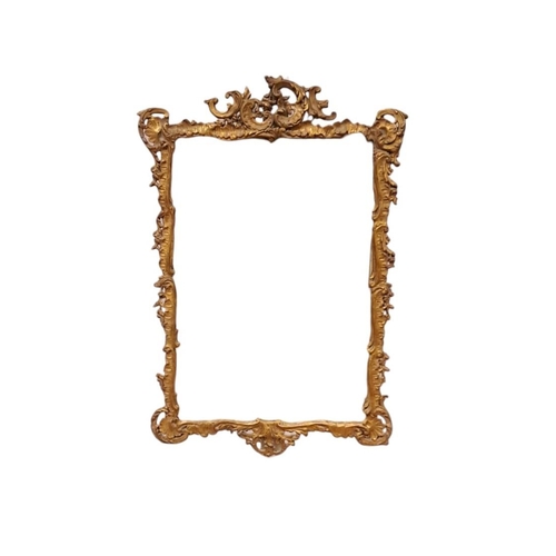 831 - A CONTINENTAL GILT FRAME MIRROR the rectangular plate within a flowerhead and foliate moulded frame ... 