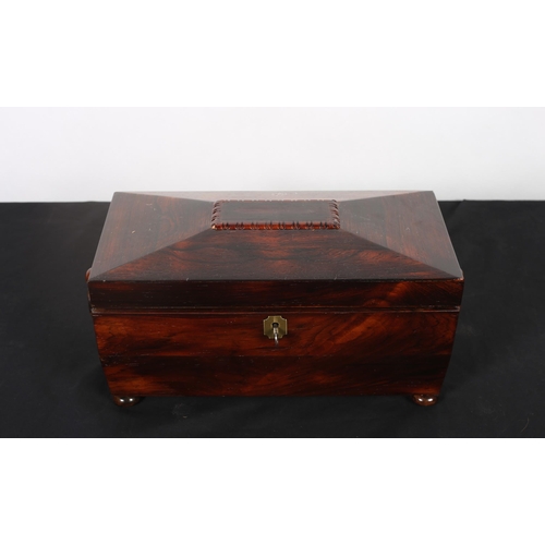 84 - A 19TH CENTURY ROSEWOOD TEA CADDY of sarcophagus outline the hinged lid with hinged compartments (la... 