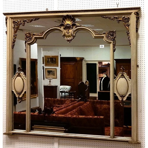 836 - A CONTINENTAL GREY PAINTED AND PARCEL GILT OVERMANTEL MIRROR the rectangular moulded frame containin... 