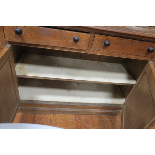 65 - A 19TH CENTURY PITCH PINE OPEN FRONT DRESSER the moulded cornice above three open shelves the base w... 