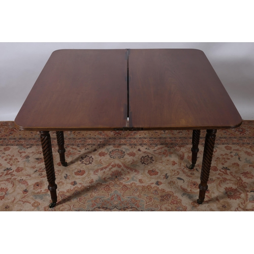 197 - A 19TH CENTURY MAHOGANY CROSSBANDED FOLDOVER SUPPER TABLE the rectangular hinged top above a moulded... 