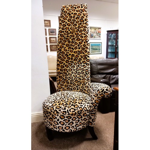 730 - A DESIGNER UPHOLSTERED LEOPARD PRINT HIGH BACK CHAIR on ebonized splayed feet