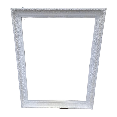 741 - A CONTINENTAL WHITE FRAME MIRROR the rectangular bevelled glass plate within a foliate and egg and d... 