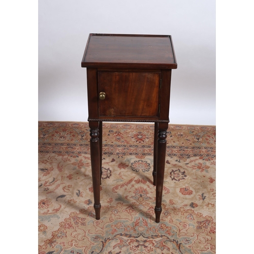 111 - A 19TH CENTURY MAHOGANY CUPBOARD the square moulded top above a panel door on cylindrical turned tap... 