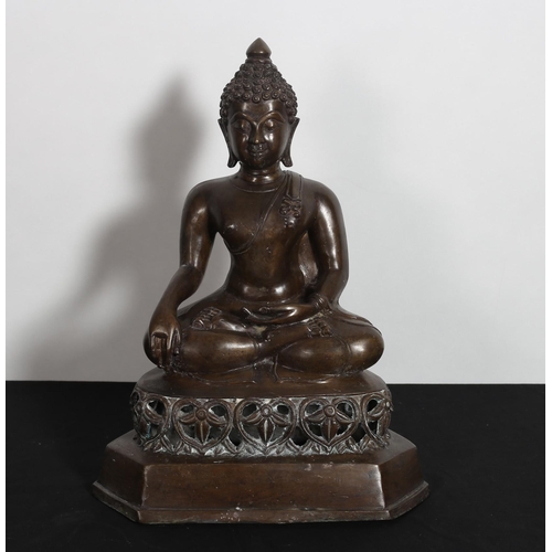 157 - A BRONZE FIGURE modelled as a Buddha shown seated on a pierced base with canted angles
43cm (h) x 33... 