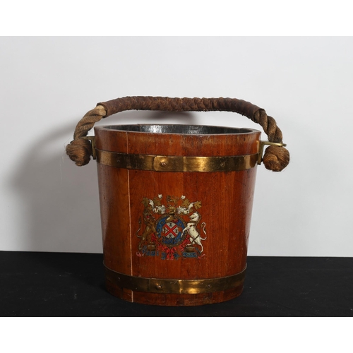 169 - A VINTAGE OAK AND BRASS BOUND BARREL of cylindrical tapering form the frieze painted with armorial c... 