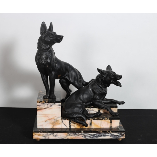 171 - after LOUIS ALBERT CARVIN 
A cast metal group of German shepherds shown seated on a stepped marble b... 