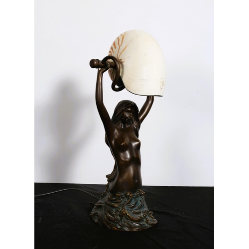 172 - A BRONZE FIGURAL TABLE LAMP modelled as a mermaid shown kneeling, supporting a conch shell raised on... 