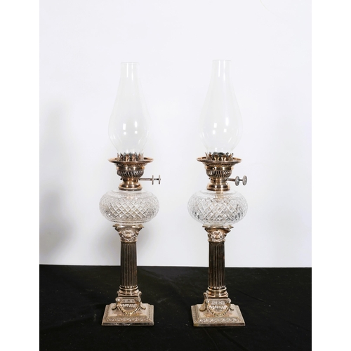 174 - A PAIR OF 19TH CENTURY SILVER PLATE AND CUT GLASS OIL LAMPS each with a hobnail cut reservoir above ... 