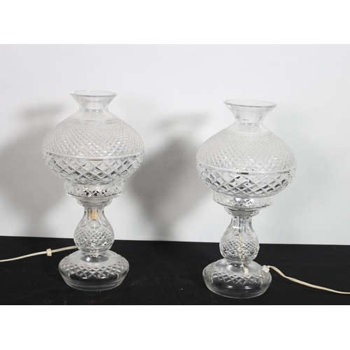 178 - A PAIR OF WATERFORD HOBNAIL CUT TABLE LAMPS each with a globe shade raised on a circular spreading f... 