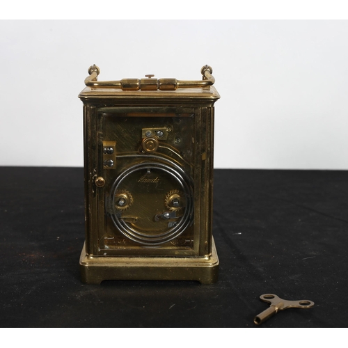 184 - A FRENCH BRASS REPEATER CARRIAGE CLOCK the rectangular case with white enamel dial and Roman numeral... 