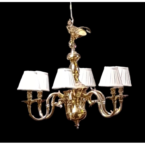 196 - A PAIR OF BRASS SIX BRANCH CHANDELIERS the baluster columns issuing six scroll arms with drip pans 
... 