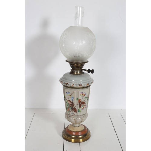 206 - A 19TH CENTURY OPALINE GLASS AND PAINTED OIL LAMP with etched glass globe the tapering column above ... 