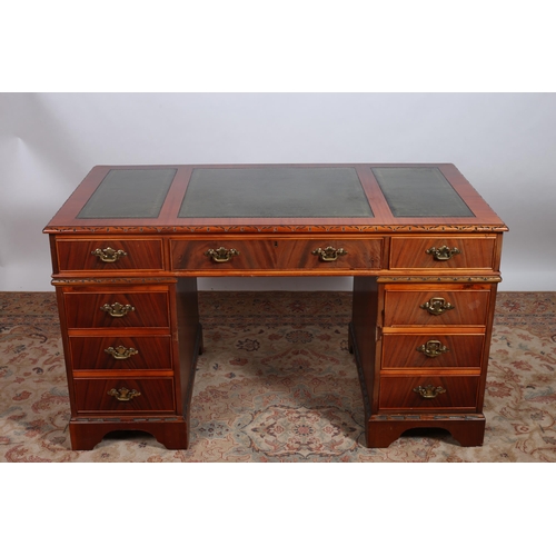 216 - A MAHOGANY PEDESTAL DESK of rectangular outline the shaped top with tooled leather panels above thre... 