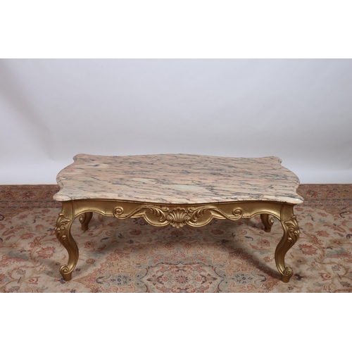 228 - A CONTINENTAL GILTWOOD AND MARBLE CONSOLE TABLE of serpentine outline surmounted by a veined marble ... 