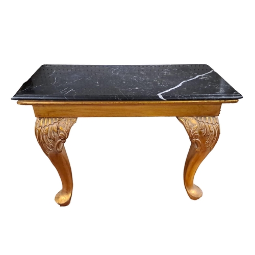 229 - A CONTINENTAL CARVED GILTWOOD AND MARBLE CONSOLE TABLE the black veined marble top above a moulded a... 