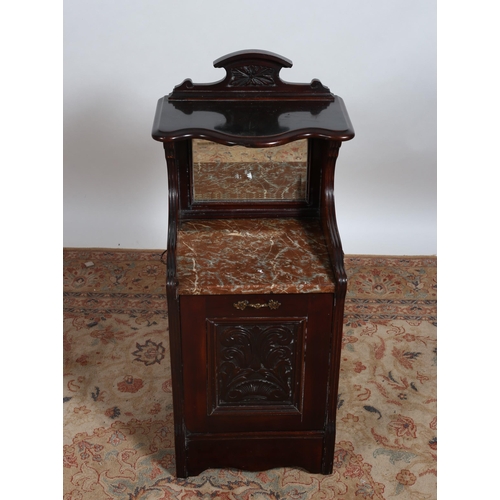 252 - AN EDWARDIAN CARVED MAHOGANY FUEL BIN the superstructure with serpentine shaped shelf above a veined... 