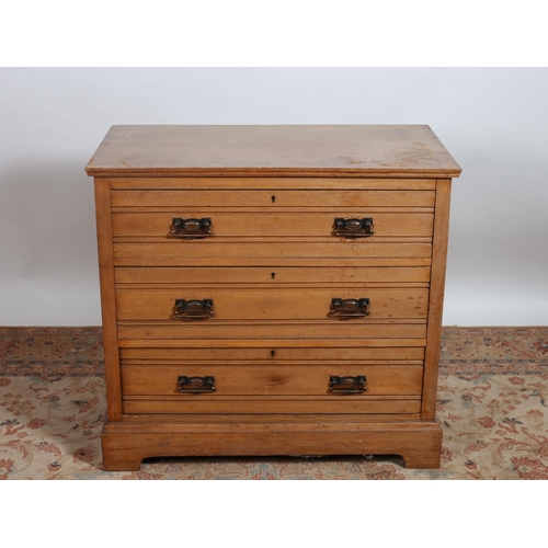 253 - A VINTAGE MAHOGANY CHEST of rectangular outline the shaped top above three long graduated drawers on... 