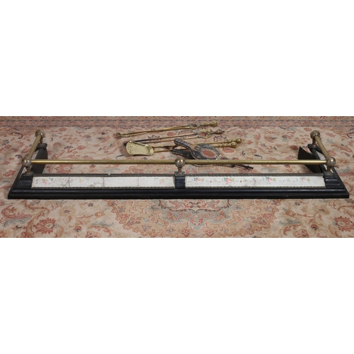 259 - A 19TH CENTURY BRASS AND BLACK METAL FIRE KERB the cylindrical top rail above a platform base 
20cm ... 