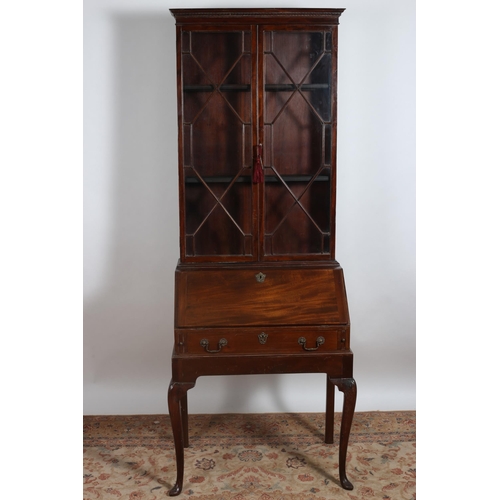 261 - A GEORGIAN STYLE MAHOGANY BUREAU BOOKCASE the dentil moulded cornice above a pair of astragal glazed... 