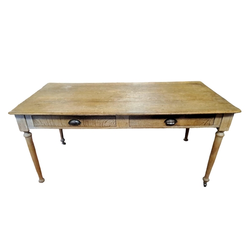 286 - A VINTAGE OAK TABLE of rectangular outline the shaped top above two frieze drawers with brass handle... 