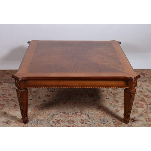 289 - A MAHOGANY AND WALNUT CROSSBANDED COFFEE TABLE of rectangular outline the shaped top with eared corn... 