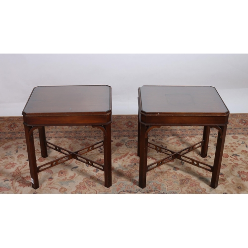 292 - A PAIR OF MAHOGANY LAMP TABLES each of rectangular form the shaped tops with frieze drawers and glaz... 