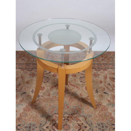 293 - A DESIGNER BEECHWOOD AND GLAZED TABLE the clear and frosted glass top raised on four chrome supports... 