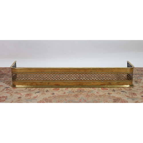 301 - A 19TH CENTURY BRASS FENDER with pierced frieze on stepped base 
21cm (h) x 130cm (w) x 30cm (d)