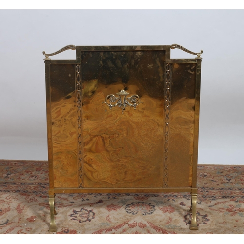 302 - A VINTAGE BRASS FIRESCREEN of rectangular form with applied decoration on splayed legs 
65cm (h) x 5... 