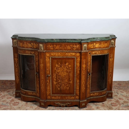 306 - A CONTINENTAL KINGWOOD MARQUETRY AND GILT BRASS MOUNTED SIDE CABINET of serpentine outline surmounte... 