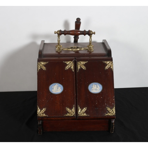 307 - AN EDWARDIAN MAHOGANY AND BRASS BOUND FUEL BIN the hinged sloped front with Jasper panels containing... 