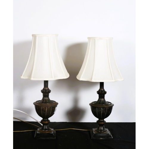 312 - A PAIR OF BRONZED URN SHAPED TABLE LAMPS with shades
63cm (h)