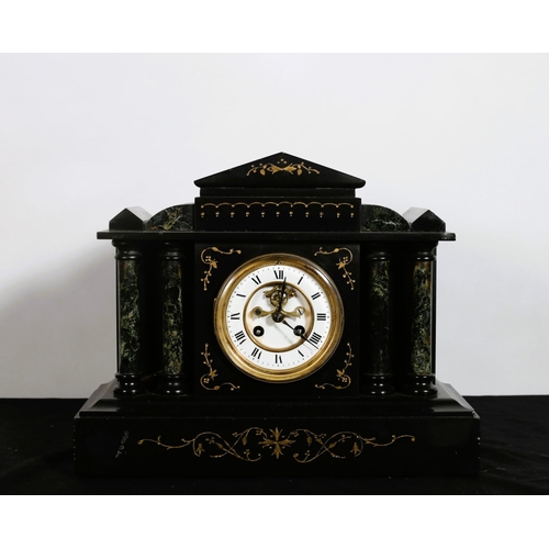 313 - A 19TH CENTURY BLACK MARBLE AND GREEN MARBLE MANTEL CLOCK of architectural form the circular white e... 