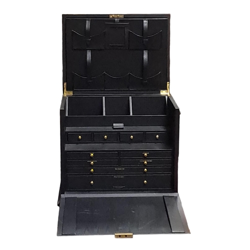 314 - A BLACK LEATHER BOUND STATIONERY CASE of rectangular outline the hinged lid containing compartments ... 