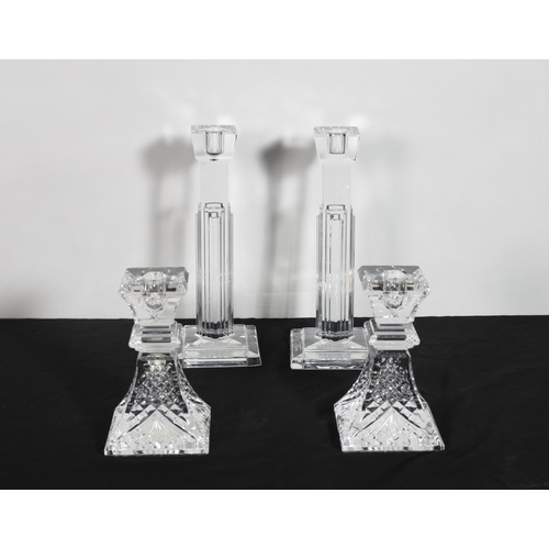 318 - A PAIR OF WATERFORD CUT GLASS CANDLESTICKS 25cm (h) together with a pair of Waterford cut glass hobn... 