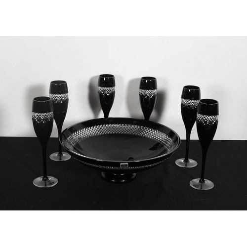 320 - A SET OF FIVE JOHN ROCHA WATERFORD CUT GLASS CHAMPAGNE FLUTES together with A BOWL en suite (7)