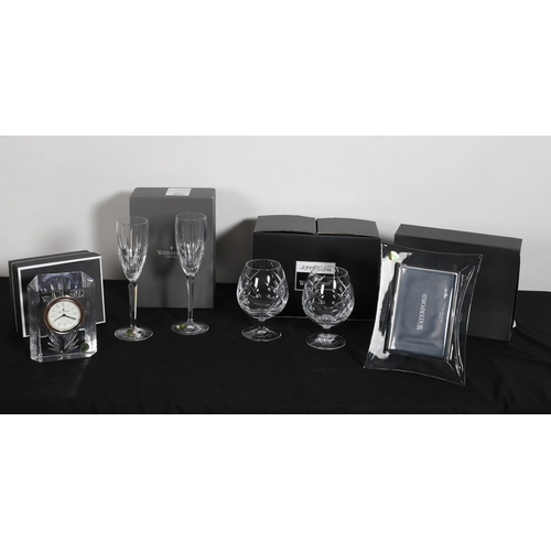 324 - A COLLECTION OF WATERFORD GLASS to include a pair of brandy rummers, a pair of champagne flutes, a p... 