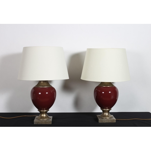 334 - A PAIR OF CONTINENTAL SILVERED AND GILT TABLE LAMPS each of bulbous form with shades
60cm (h)